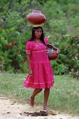 Resident of Lamas with Jugs