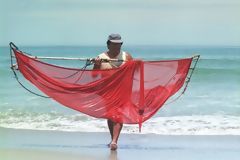 Larvae fisher coming out of the sea